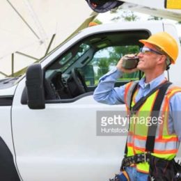construction worker talking on radio